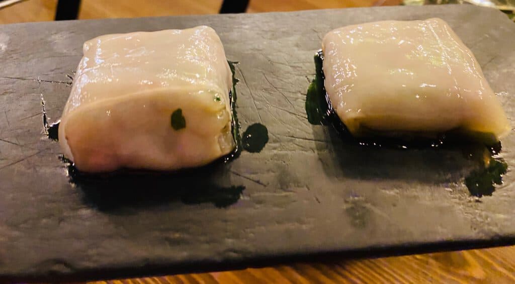 Sea bass tartare in lardo