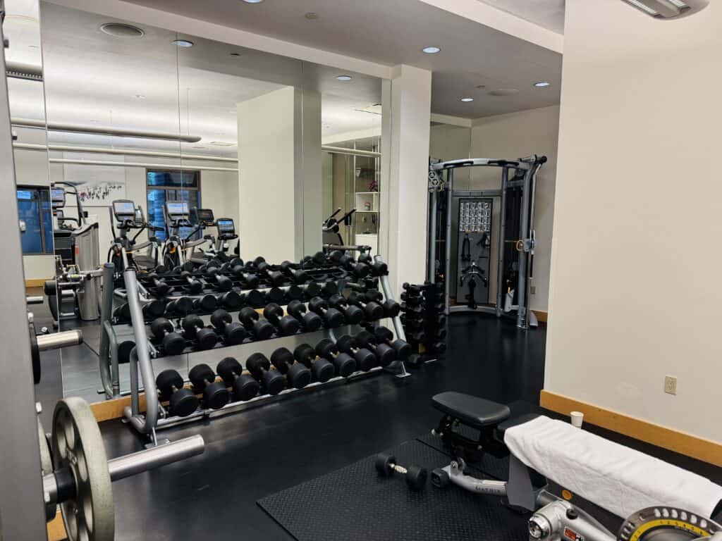 a gym with weights and mirrors at Four Seasons Whistler