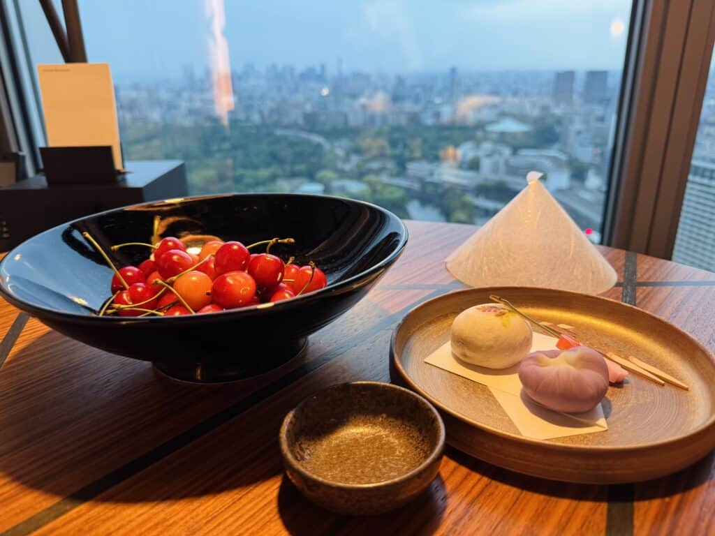 Cherries in the hotel room with a view of Tokyo city