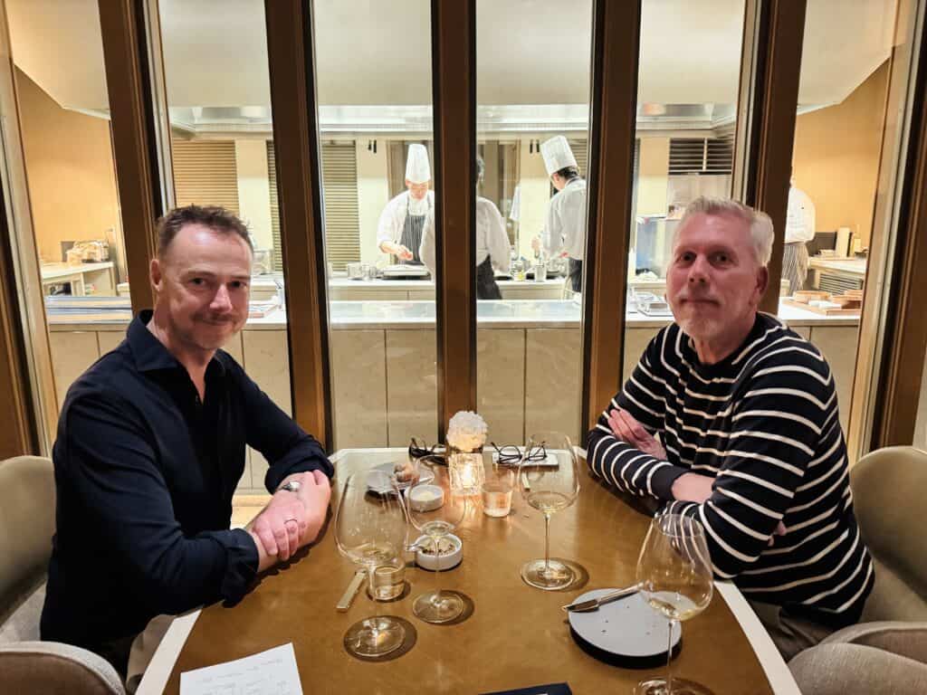 At the table in restaurant Est with a view of the kitchen