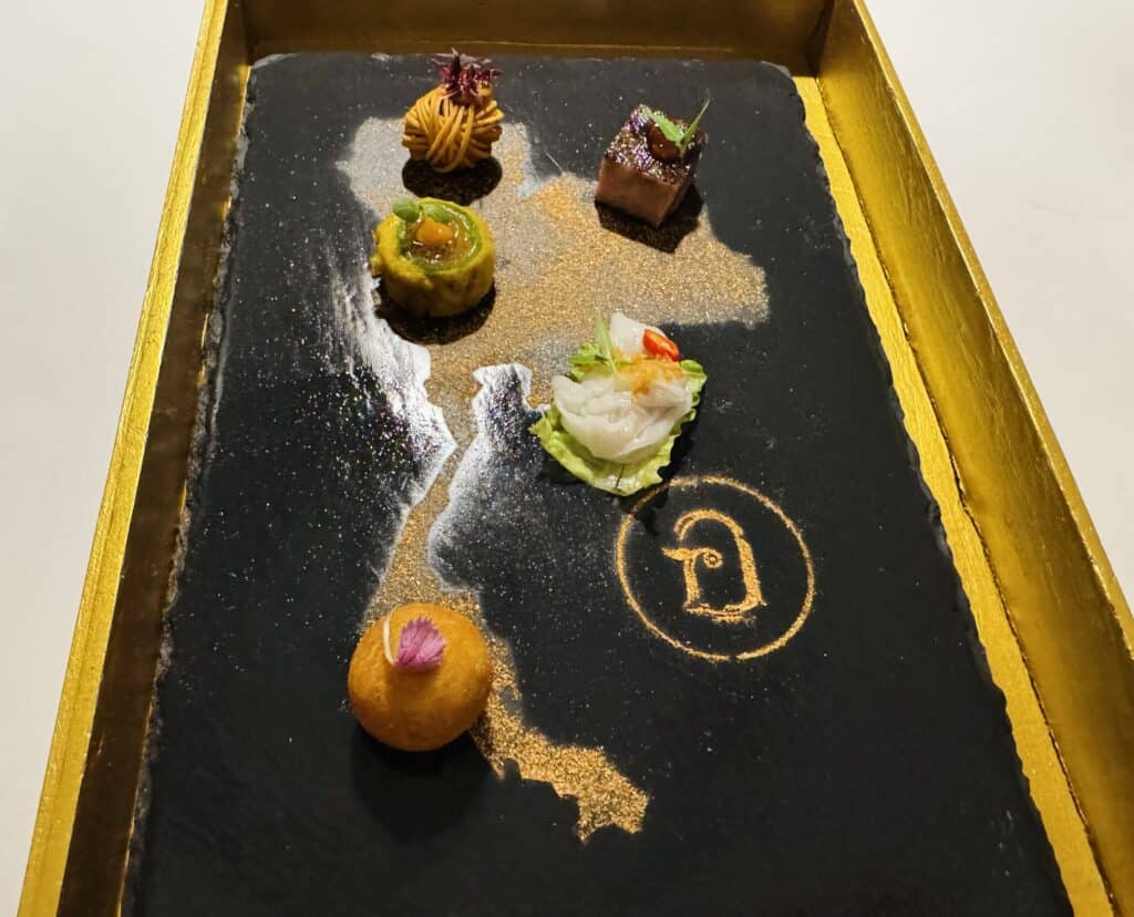 Selection of amuse-bouches at R-Haan, served on a platter in the shape of Thailand.