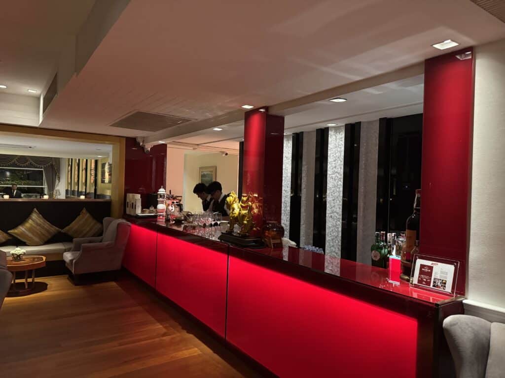 Red bar and lounge area of R-Haan restaurant in Bangkok.