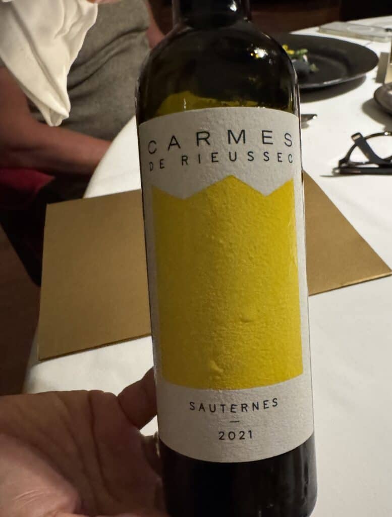 Bottle of Carmes de Rieussec Sauternes 2021, served with dessert in R-Haan.