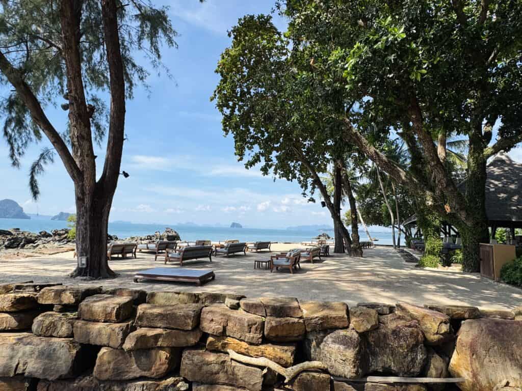 Luxurious beach chairs overlooking limestone islands at Phulay Bay Ritz-Carlton Reserve Krabi