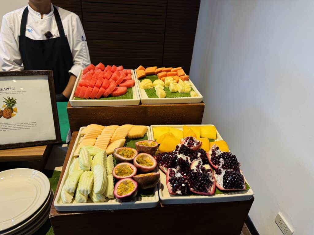 Fresh tropical fruit buffet with watermelon, papaya, melon, passion fruit, and pomegranate at Phulay Bay, a Ritz-Carlton Reserve.