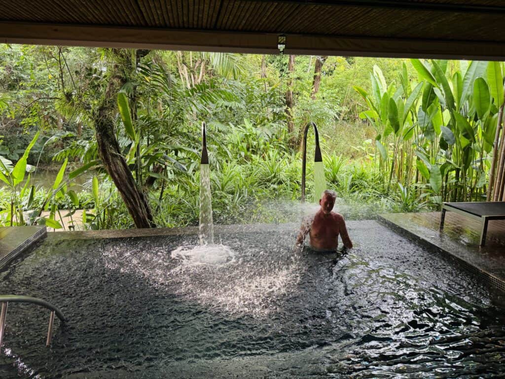 A hydrotherapy pool with water jets in the jungle at Phulay Bay's SPA Spa in Krabi.