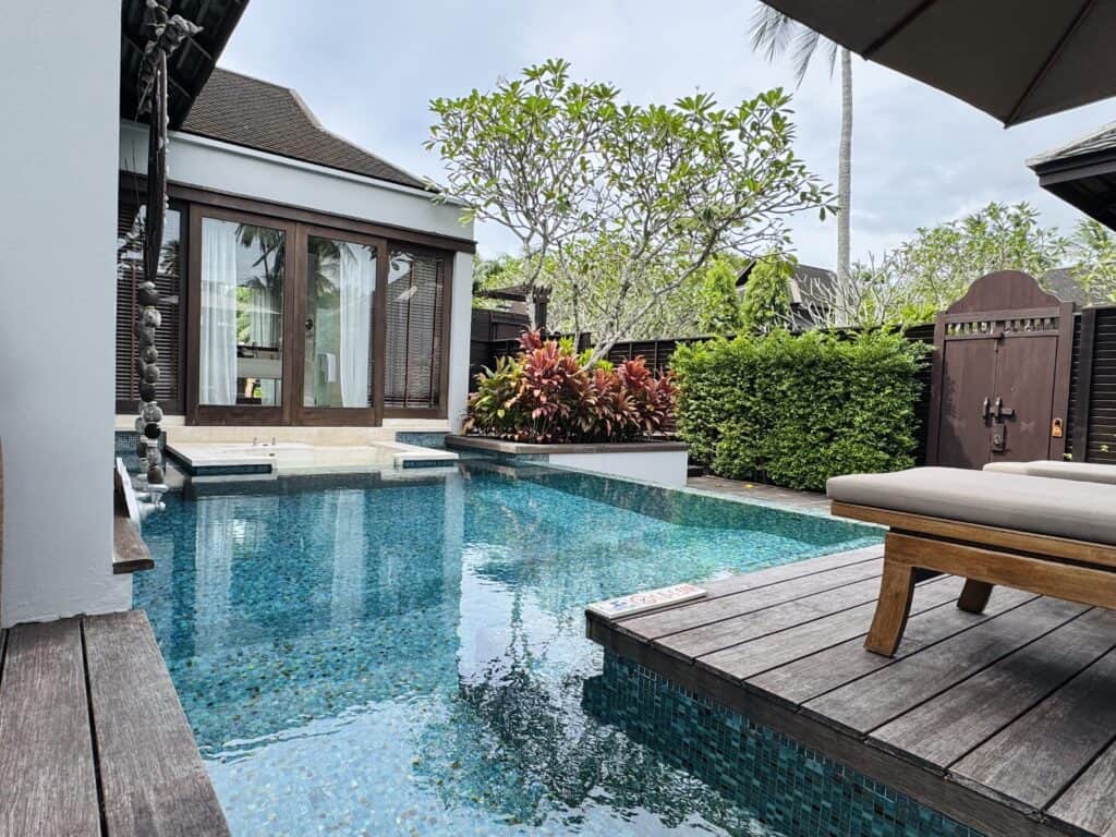 Private pool at the Sala Pool Villa of Anantara Mai Khao Phuket with wooden terrace and tropical garden