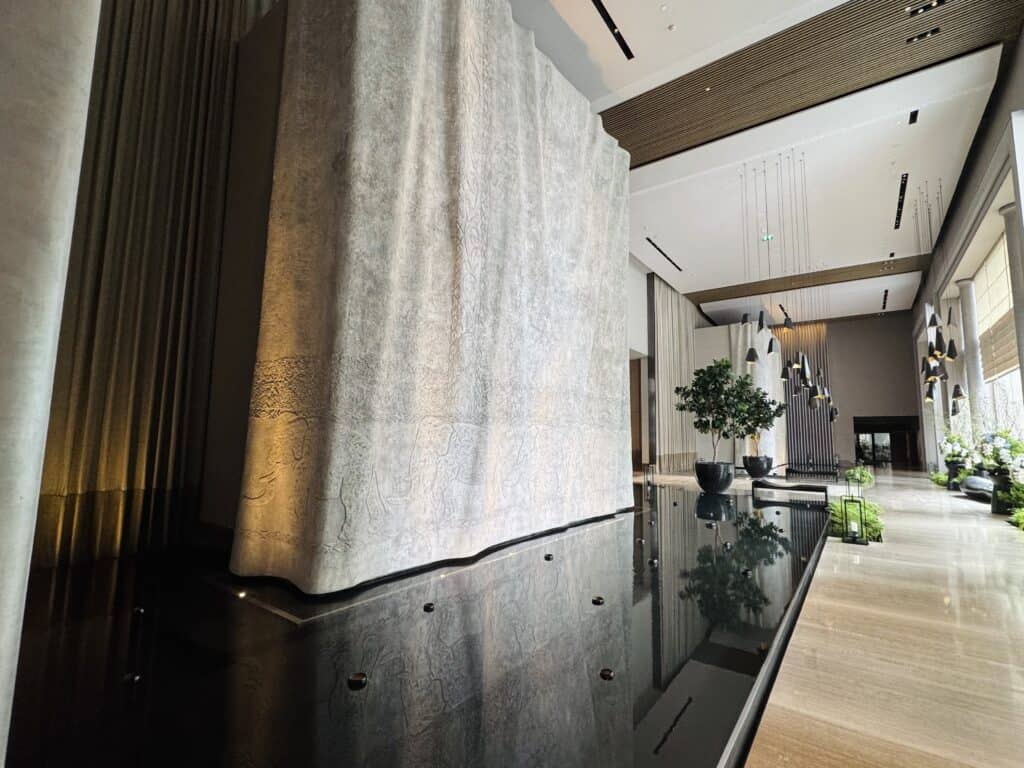 Modern architectural water artwork in Four Seasons Hotel Bangkok lobby
